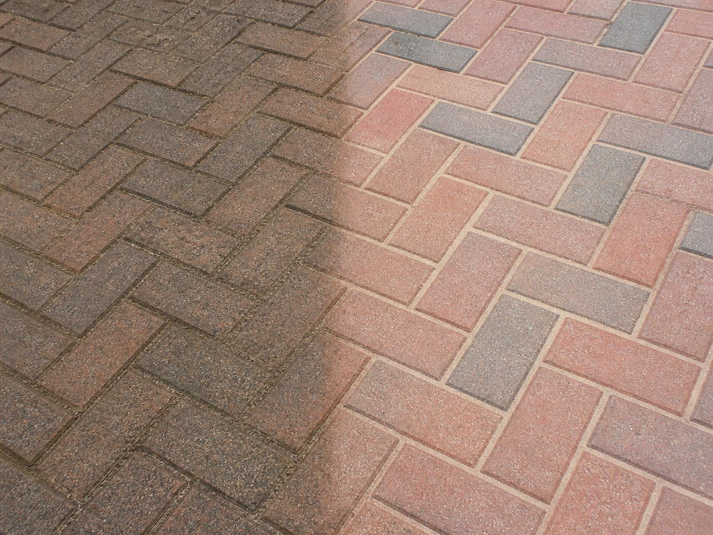 A block paved driveway being restored and cleaned